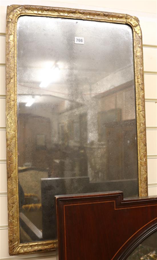 An early 18th century gilt gesso wall mirror, with arched plate, W.46cm